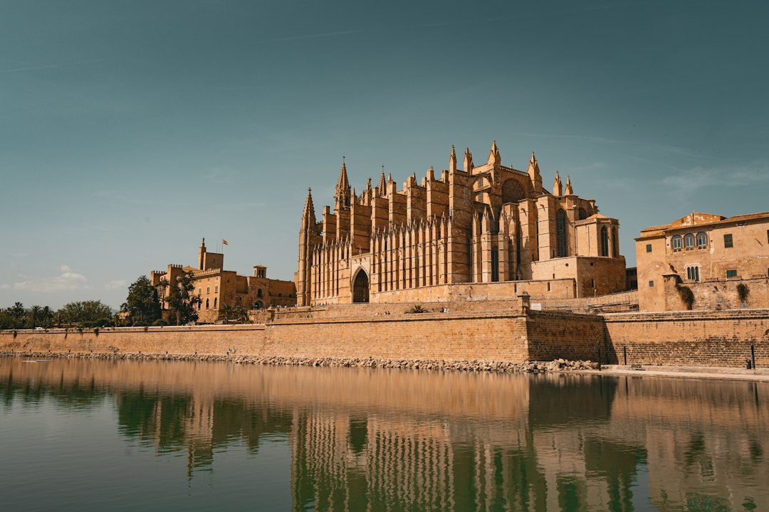 Palma Cathedral reflected in the water in Mallorca, Spain